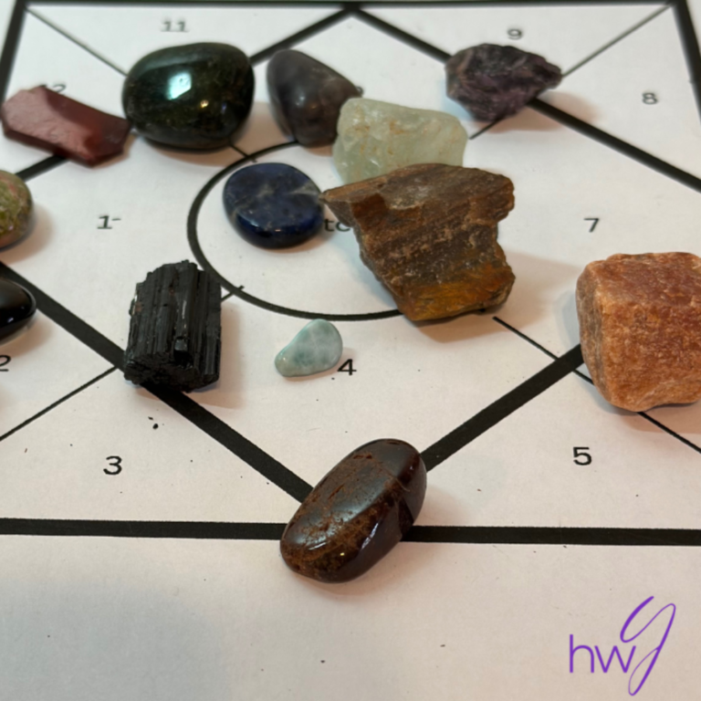 An image of many crystals on top of a healing sessions board